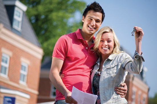 New homeowners with keys in hand