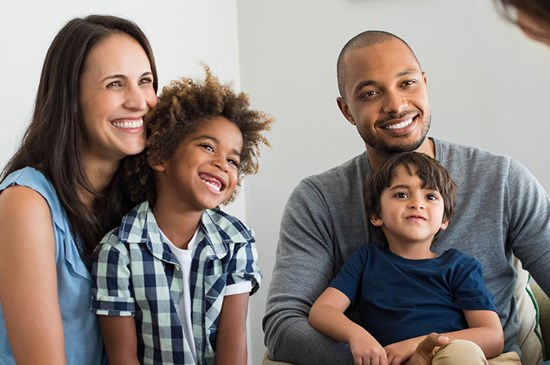 Stock photo of family talking to mortgage loan officer