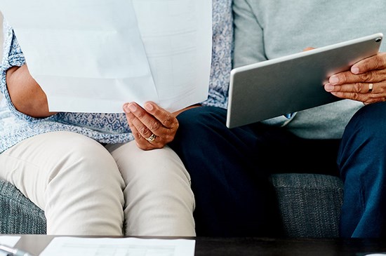 Stock image of two people reviewing a financial plan